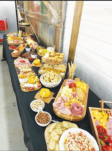 Pictured are some of the custom cake decorating and long-board charcuterie products offered by Longer Table.